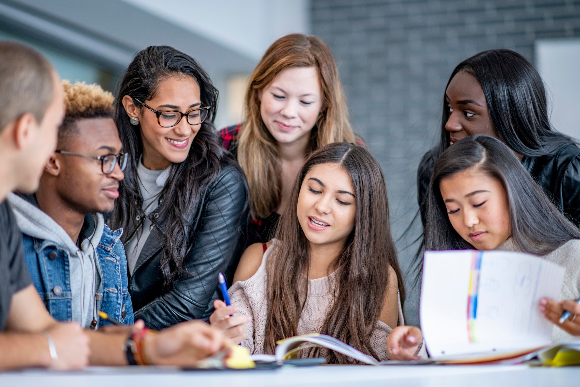 Students studying together with enthusiasm